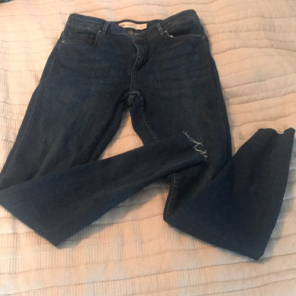 BNWOT dark blue ASOS jeans with distressed hem.